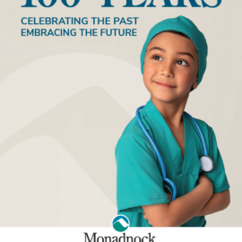 Young boy in green medical scrubs with a stethoscope around his neck, smiling confidently. Text reads "100 Years - Celebrating the Past, Embracing the Future." Monadnock Community Hospital logo with "1923-2023" underneath. On the cover: Jackson Meas, age 7, was born at MCH and receives primary care from Dr. Hurley at Monadnock Regional Pediatrics.