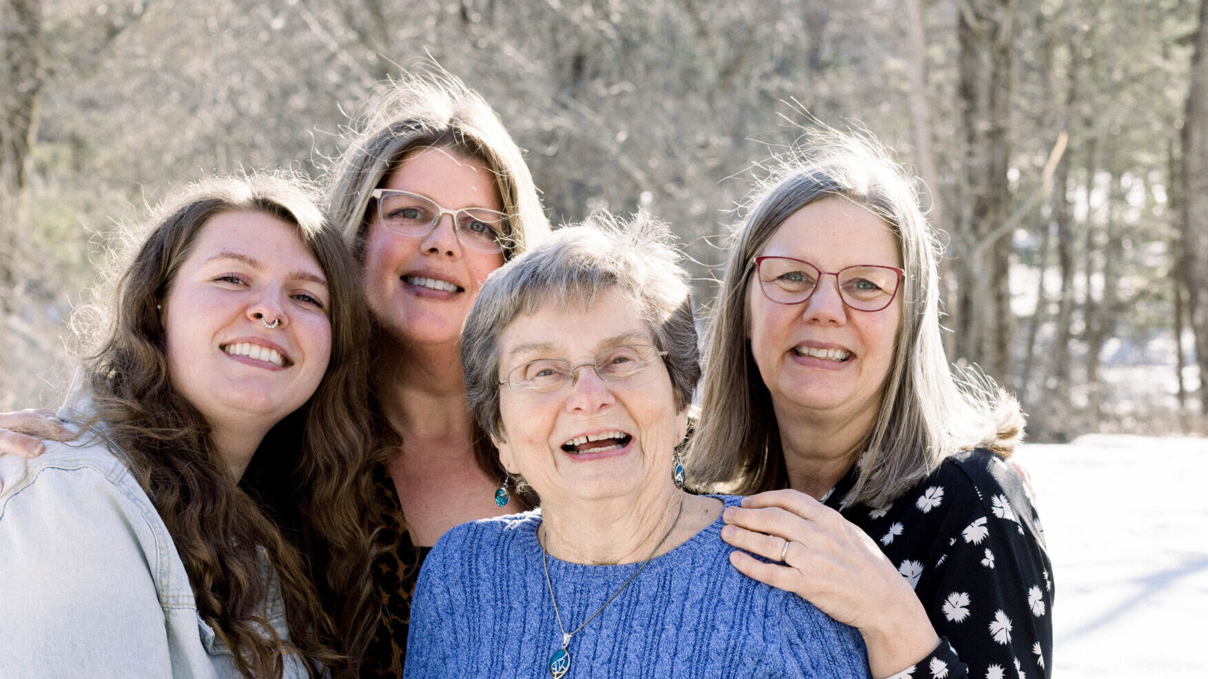 Madison Wright, Jennifer Wright, Gail Niskala, and Deborah Wright smiling and standing together outdoors in a snowy setting, showing three generations of a family