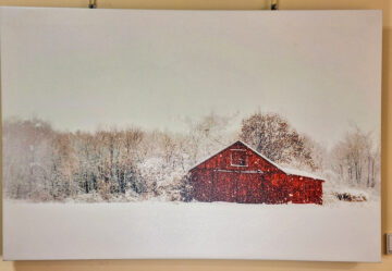 Photo on canvas red barn in a snowy scene