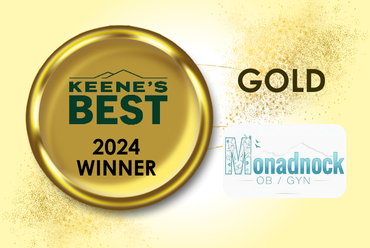 A gold circular emblem on a pale yellow background, featuring the text "Keene’s Best 2024 Winner" in green within the circle. To the right, the word "Gold" is displayed in large, bold letters. The emblem is connected with a line to the Monadnock OB/GYN logo, which includes the name "Monadnock OB/GYN" with a stylized mountain graphic in light blue and gray