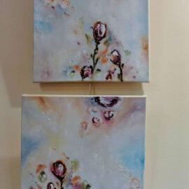 A pair of abstract paintings displayed one above the other. Each features a light pastel palette with pink flowers and swirling patterns, creating a harmonious and tranquil visual flow