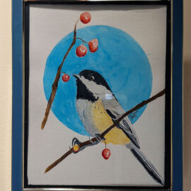 A framed watercolor painting by Kiera Burak of a black-capped chickadee perched on a branch with berries. The painting features a blue circular background, enhancing the natural beauty of the bird and its surroundings.