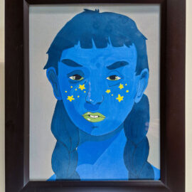 A framed painting of a person's face in shades of blue with green eyes and lime green lips. Their cheeks are decorated with yellow stars as freckles. The background is a dark color, contrasting with the vivid hues of the face