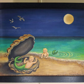 A whimsical painting featuring two babies with mermaid tails on a beach under a night sky. One baby lies inside an open clam shell on the sand, while the other plays in the ocean waves. Seagulls fly above, and a full moon illuminates the scene. The painting is framed in black and exudes a playful, dreamlike quality