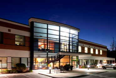 The Monadnock Community Hospital Bond Wellness Center building captured in soft light, showcasing its elegant and inviting entrance