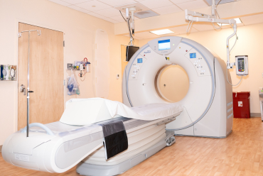 A modern medical imaging device in a well-lit room, symbolizing advanced technology and innovation at Monadnock Community Hospital