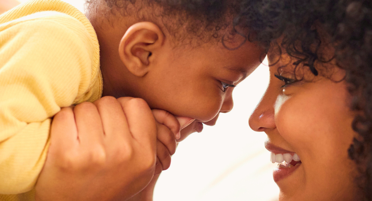 A joyful moment between a mother and baby, capturing the strong family bonds supported by the Healthy Beginnings Monadnock program