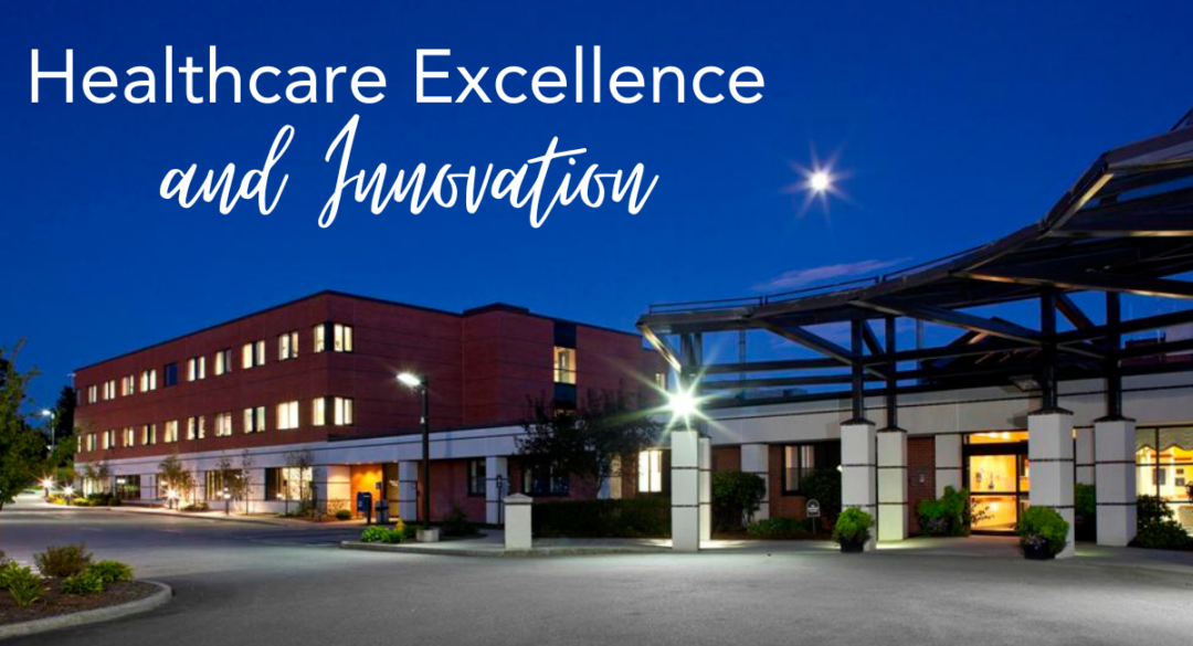 Exterior view of Monadnock Community Hospital at night, with building lights illuminated and a clear sky showcasing a bright moon. The text 'Healthcare Excellence and Innovation' is displayed prominently in the upper-left corner of the image