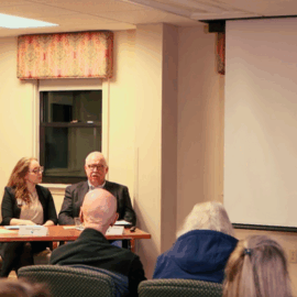 A panel of experts, including hospital representatives, presents an informative session on advanced directives, aiming to provide clarity and guidance on this important topic