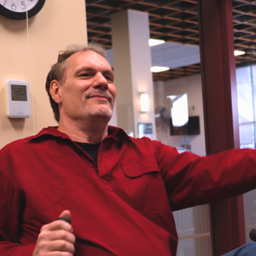 Bruce confidently exercises on a fitness machine at Monadnock Community Hospital, demonstrating the progress achieved through the Pulmonary Rehab program