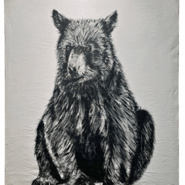 A black and white painting of a seated black bear on canvas drop cloth, with bold brush strokes giving the animal a textured and expressive look.
