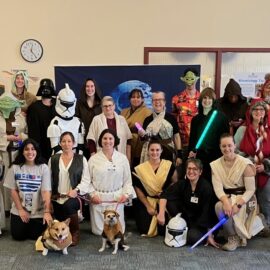 Employees from Monadnock Community Hospital’s Rehabilitation department dressed as Star Wars characters, including Darth Vader, Yoda, and Princess Leia, posing together in costume with props like lightsabers