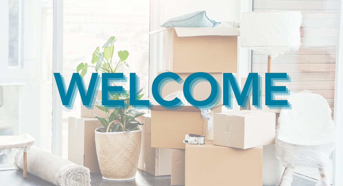 "Welcome sign displayed over a background of moving boxes, a potted plant, and furniture, symbolizing a fresh start or relocation