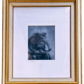 A charcoal and pastel drawing of a black bear in profile, titled Resilience, framed with a double mat and gold-trimmed wooden frame. The bear's gaze is calm and focused, set against a softly shaded background. Artwork by Christina Johnson.