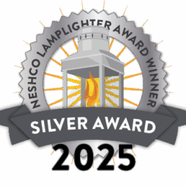 Lamplighter Award badge reading “NESHCo Lamplighter Award Winner, Silver Award 2025,” featuring a silver lantern with a glowing flame and radiating orange lines.
