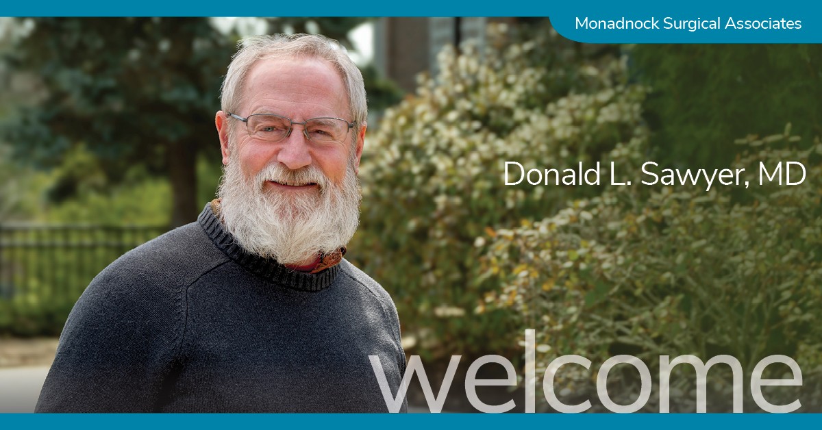 Smiling man with a full white beard and glasses, wearing a dark sweater, standing outdoors in front of shrubs. Text reads “Donald L. Sawyer, MD” with a banner that says Monadnock Surgical Associates.