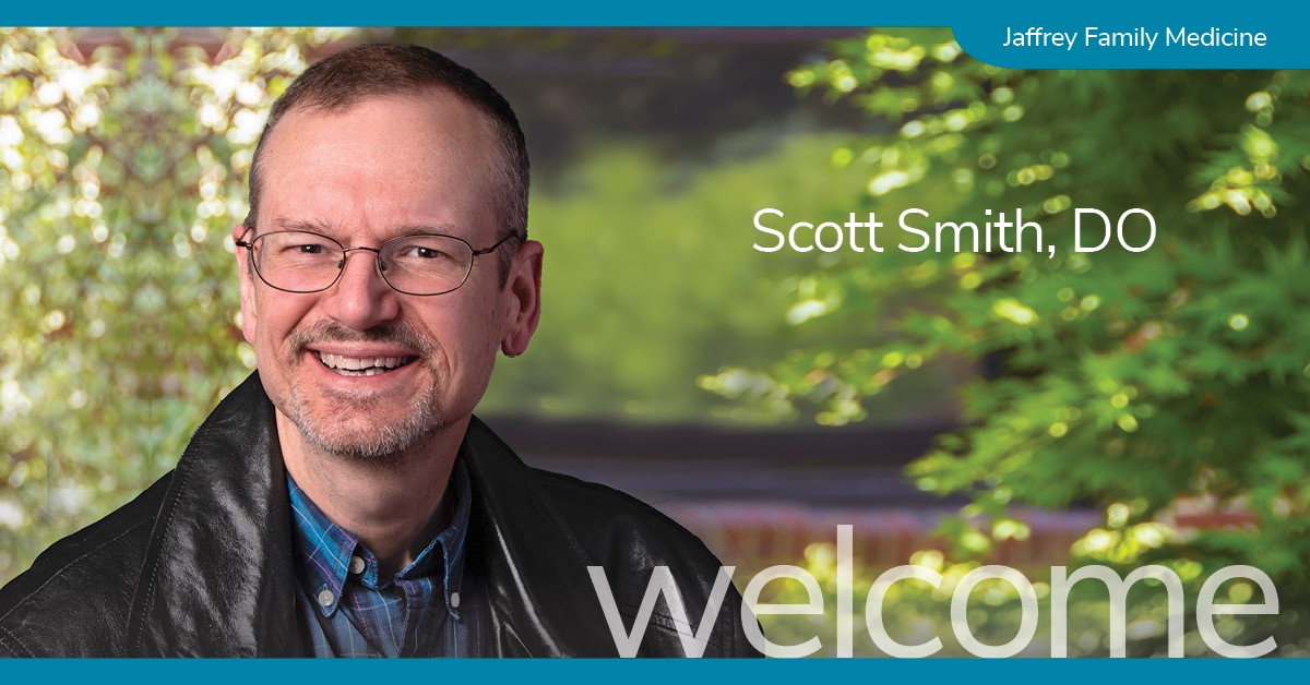 Smiling man with glasses wearing a black leather jacket and blue plaid shirt, standing in front of greenery. Text reads “Scott Smith, DO” with a banner that says Jaffrey Family Medicine.