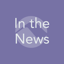 Lavender square button with the words ‘In the News’ over a stylized mountain icon