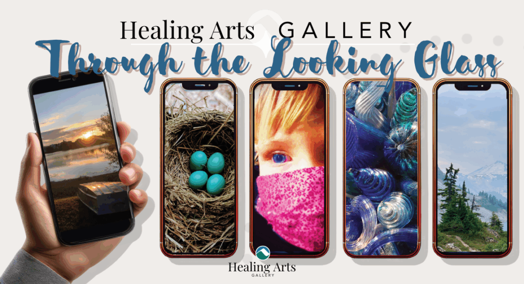 A banner for the Healing Arts Gallery exhibition Through the Looking Glass. Several smartphone screens display different employee photographs, including a sunset over water, a nest with turquoise eggs, a close-up of a child in a pink scarf, colorful glass art, and a mountain landscape with trees. A hand holds one of the phones on the left side. The Healing Arts Gallery logo appears in the lower left corner.