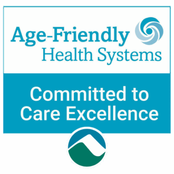 Teal and white badge with the text “Age-Friendly Health Systems, Committed to Care Excellence” above the mch mountain icon.