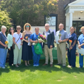2026 DAISY Award recipient Beth LeClair, fellow nominees, and hospital leaders pose for a group photo outside Monadnock Community Hospital following the annual DAISY Award ceremony.