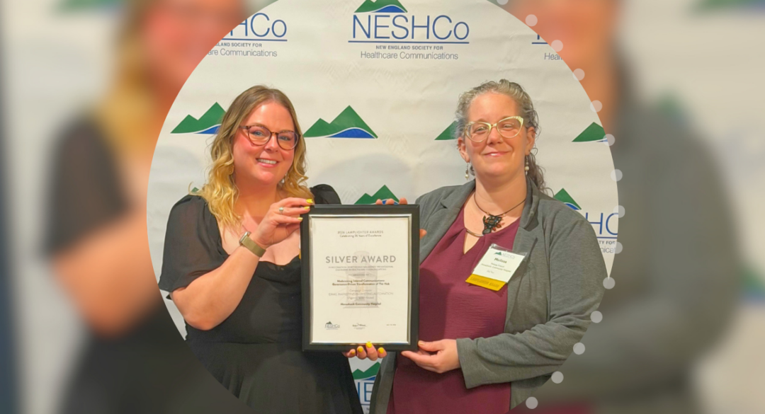 Alycia McDuff and Melissa French pose with a NESHCo Lamplighter Award certificate recognizing Monadnock Community Hospital's employee intranet transformation project. They stand in front of a New England Society for Healthcare Communications backdrop while holding the framed Silver Award.